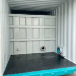 Struttura interna di un container industriale con prese d'aria e rinforzi per impianti specifici.