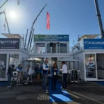 Stand fieristico Sogace in container modulari con terrazza e spazi espositivi al GIS EXPO Piacenza
